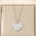 Silver leaf pendant necklace with three pearls on a textured golden surface - Steel Color (KP116044-MZOZ)