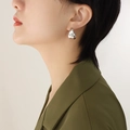 Minimalist silver irregular C-shape geometric earring worn on ear for women - Silver