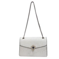 Silver snakeskin crossbody bag with blue gemstone buckle and metal chain strap - Off White