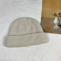Oatmeal beige knitted docker cap with turn-up cuff on white textured background - One Size / Apricot