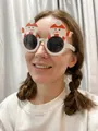 Detail view of festive snowman Christmas glasses for holiday party dress up and props - Scarf Snowman