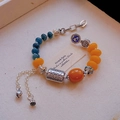Ethnic vintage beaded bracelet with agate beads and silver floral hollow metal charms - Water Grass Bead: Tassel Imitation Amber Bracelet