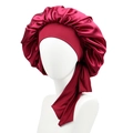 Detail of burgundy satin hair bonnet showing the smooth texture and wide elastic ribbon ties - Burgundy