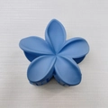 Blue matte finish plumeria flower hair claw clip displayed on a white textured background - Medium Matte Style / 6cm / Blue