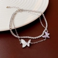 Double-layered butterfly bracelet with purple zircon and white mother of pearl finish - Butterfly Zirconia Double Layer Bracelet
