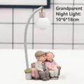 Elderly couple on sofa night light resin figurine ornament, pink and grey, 10x6x18cm - 1041-12 Holding Cat with Light