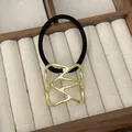 Punk style ponytail cuff with gold geometric metal hollow detail and black elastic band - GD432 Gold Irregular Hollow
