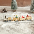 Wooden Christmas train ornament with snowman and tree figures on a snowy background - Natural Wood Train