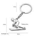 Polished silver metal skier keychain with dynamic pose and 4mm thickness detail - Skier (Silver)