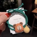 Green knitted bow hair tie with a 3D cartoon bear charm and rhinestone details - Green Bear Card Model