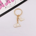 Detail of golden western cowboy keychain with white enamel hat and boot pendants - 2 White - Gold Ring / White