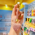 Pink rhinestone heart keychain with gold clasp and sparkling hand strap in a bright display - Pure Pink Heart