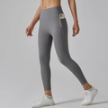 Detail of high waisted yoga leggings with side pockets showing mobile phone storage - Titanium Gray