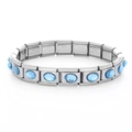 Detailed close-up of a stainless steel stretch bracelet featuring oval blue gemstones - 0896-oval Sapphire Section 1