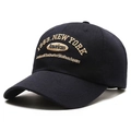 Close-up of 1989 New York embroidery on navy blue cotton twill baseball cap - Blue