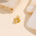 Macro shot of gold-plated spider charm with oval crystal for DIY jewelry making - White