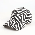 Detail of baseball cap showing black and white zebra print and curved brim texture - Adjustable / White Zebra