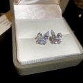 Close-up of rabbit stud earrings with sparkling cubic zirconia on a velvet display box - Rabbit Stud Earrings / Silver