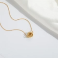 Elegant gold choker necklace featuring a woven twisted rope round pendant on a thin chain - Gold Round