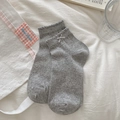 Calze a rete grigio chiaro da donna con fiocchi decorativi e bordo a balze - Grigio