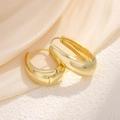 Chunky gold-plated hoop earrings with polished teardrop shape and secure latch back - Teardrop Hoops / Gold
