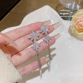 Elegant silver snowflake earrings with shimmering long tassels and zircon crystal studs - Snowflake Diamond Tassel (E0114)