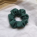 Elegant green fabric scrunchie with soft pleats in a ballet ribbon style hair accessory - Green Cream Scrunchie