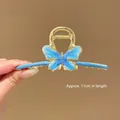 Large gold-toned metal hair claw clip featuring a light blue butterfly design, 11cm length. - Blue Butterfly Claw Clip