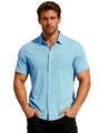 Close-up of light blue men's shirt showing the jacquard texture and front chest pocket - Light Blue