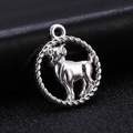 Macro shot of an antique silver Aries zodiac pendant on a dark leather background - Style 8 / Antique Silver