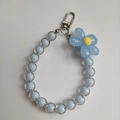 Detail of blue candy bead phone strap with clear flower charm and silver metal clasp - Blue Beads Blue Flower