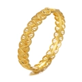 Detailed close-up of golden lace-style hollow pattern on a metal bridal wedding bangle - Style 4