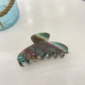 Detail showing marble texture on large acetate hair claw clip with glossy finish - Approx 10.5cm / Green Brown Shell Pattern