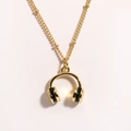 Macro view of golden headphone pendant necklace with beaded stainless steel chain - Black Headphones