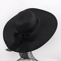 Women's black wide-brim straw sun hat featuring a large elegant mesh bow detail - One Size / Solid Black