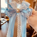 Blue ribbon and lace bow hair clip featuring a large center pearl and sparkling rhinestones - Streamer Hair Clip / Light Blue