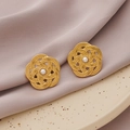 Golden woven flower earrings with inlaid pearls on a lavender silk and ceramic backdrop - Gold + Pearl