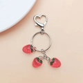 Detailed view of red strawberry pendants with silver heart clasp and key ring - Red Strawberry (With Keychain)