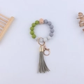 Silicone bead wristlet keychain with olive green beads, wooden hexagon, and grey tassel - Avocado Green