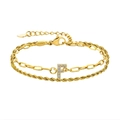 Bracelet double chaîne dorée avec pendentif lettre F serti de zircons et fermoir - Lettre F