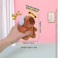 Brown Capybara plush keychain with blue accessory, features a built-in squeak effect - Blue Earphones Strange Howl Capybara