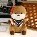 Cute graduation otter plush toy with doctoral cap and diploma on a cozy desk - 25cm / Red Style (With Red Tassel)