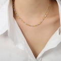 Minimalist two-tone gold and silver link necklace shown on a model neck with a white shirt - Medium Version / Gold and Steel Mixed