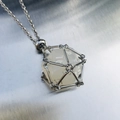 Silver chain necklace with a translucent white polyhedral dice pendant in a metal cage - Silver Cage with White Dice