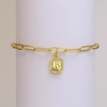 Gold paperclip chain bracelet featuring an octagonal pendant with letter B and white zircons - Letter B