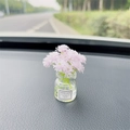 Car dashboard ornament featuring a glass wish bottle with pink flowers and good luck label - Light Purple Gypsophila