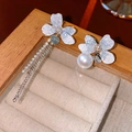 Asymmetric flower earrings with pearl and long tassel chain on wooden jewelry box - Asymmetric Flower Tassel Style (Silver Earring Post Style 1)