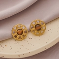 Vintage gold woven earrings with central brown tiger eye stones on purple silk background - Gold + Tiger Eye