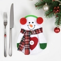 Christmas snowman cutlery holder set with knife and fork on festive decorated table - Snowman with Earmuffs Style