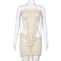 Close-up of cream knit two-piece set featuring hollow-out crop top and mini skirt - L / Apricot